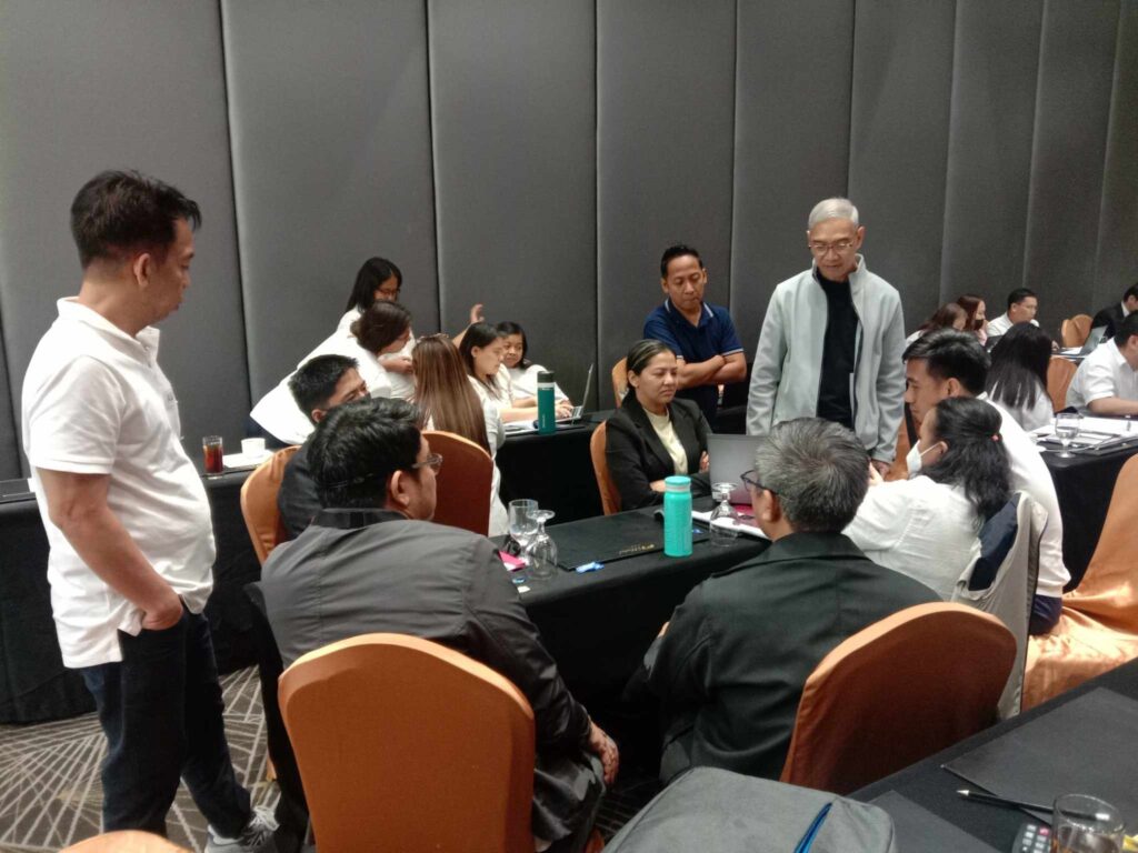 Sonny Del Rosario facilitating a management discussion